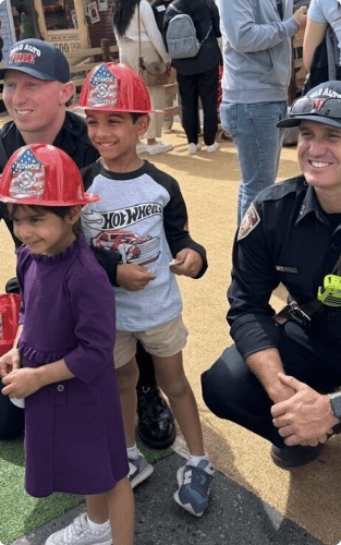 kids wearing firefighter cap